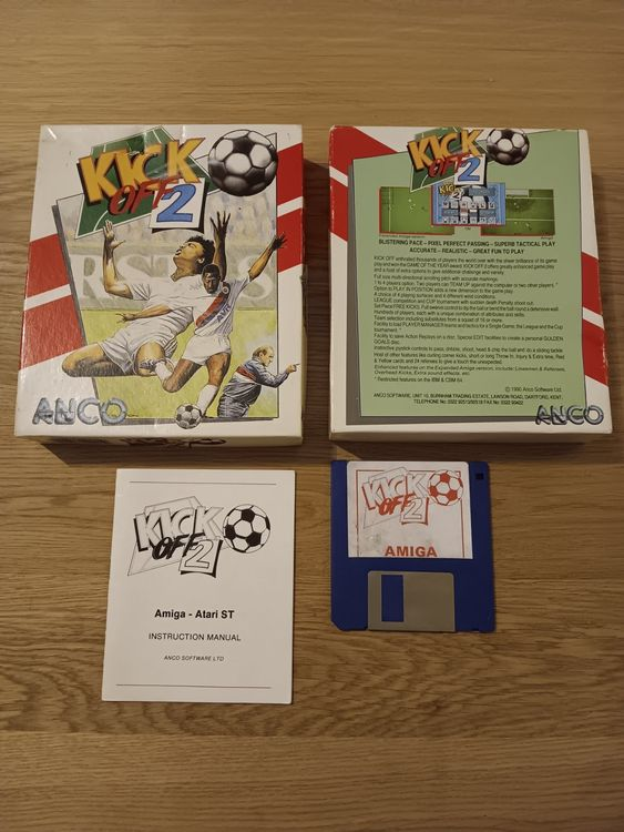 The Kick Off 2 box opened up, showing the manual and the blue Amiga disk.